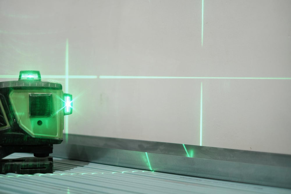 Laser beams measuring level of construction work during work shallow depth field